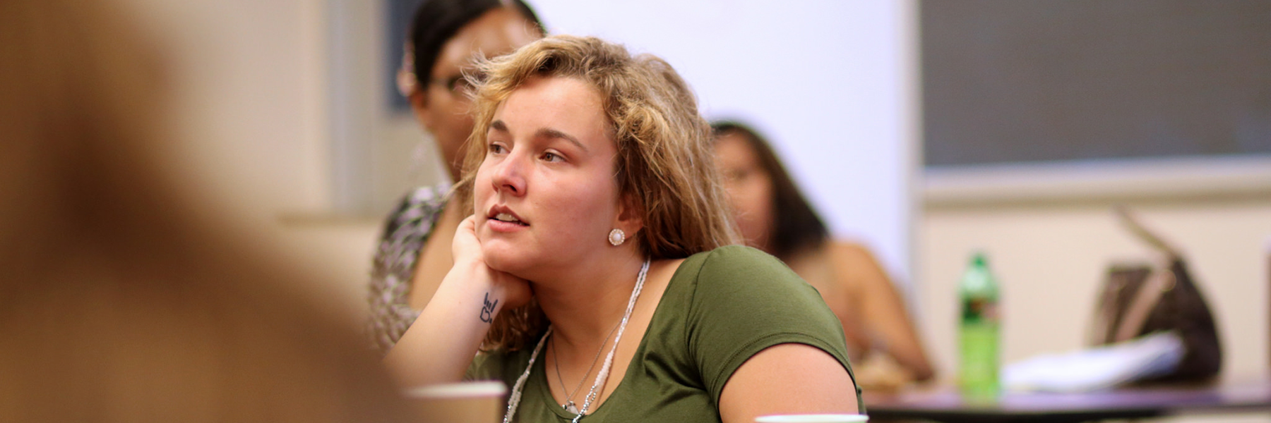 A woman listening closely.